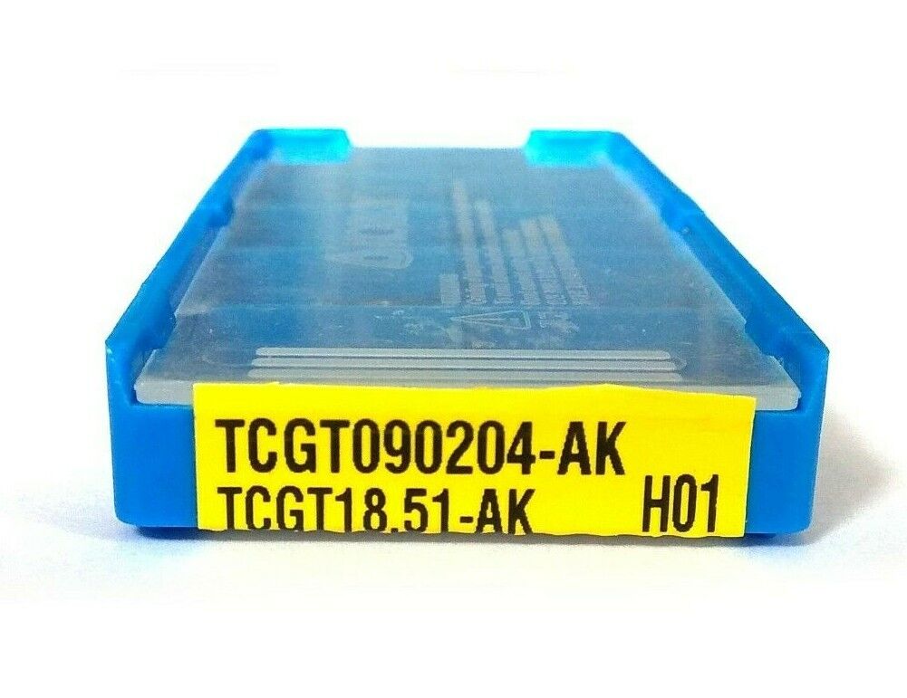 A box of TCGT090204-AK H01 uncoated triangular carbide inserts shown from the front